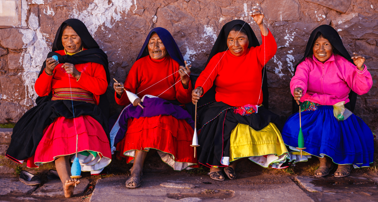 Indigenious Latin American Women together having fun and laughing to the camara