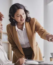 two women in banking looking at financial statements