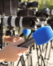 Journalist's microphones outside a press conference