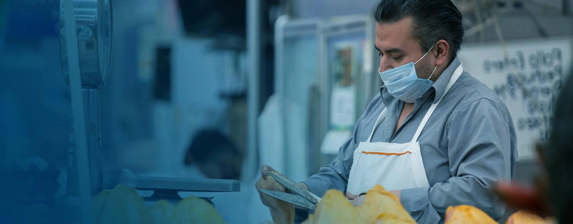 Image of a mand working at a butchery store