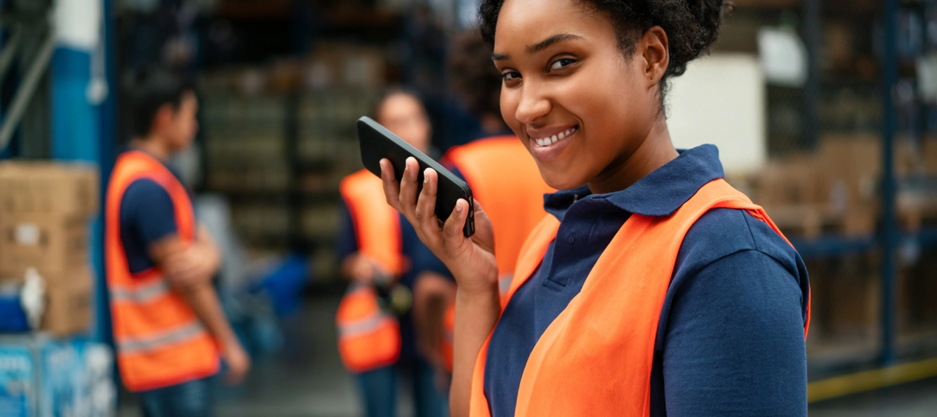 Image of an african-american woman working at a cargo company warehouse