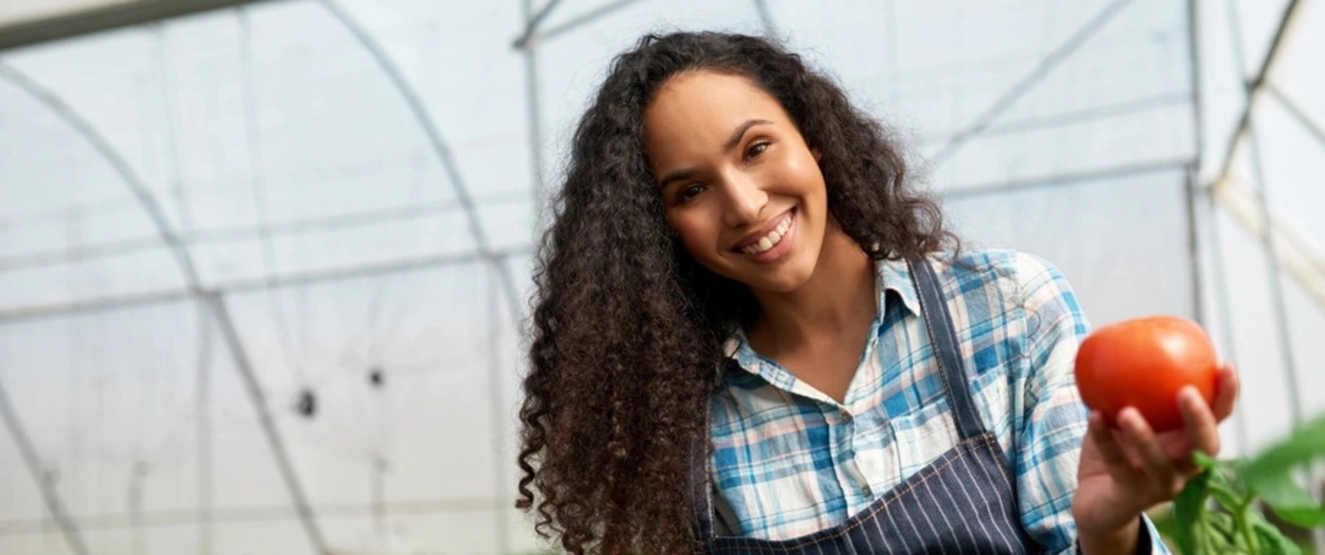 Image of a woman holding a tomato