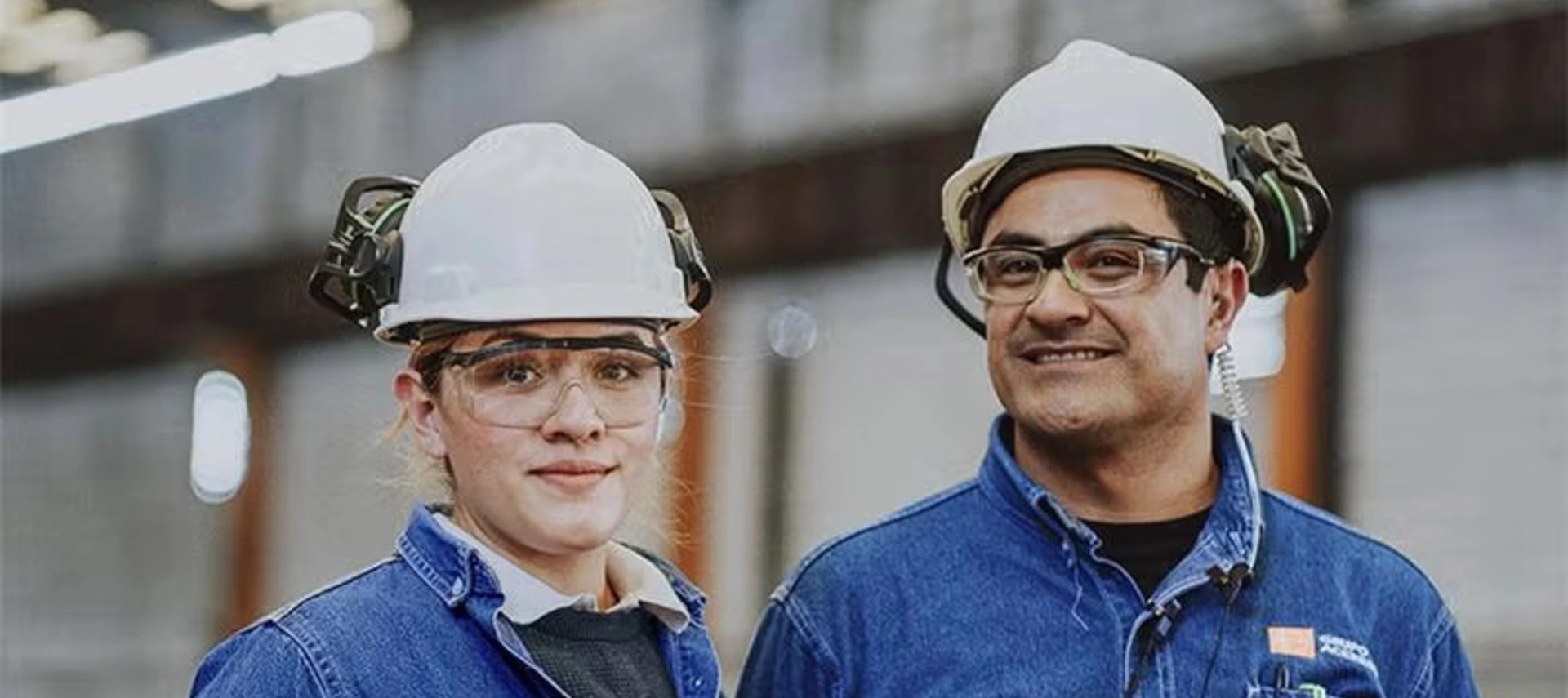 Banner image of two steel factory workers