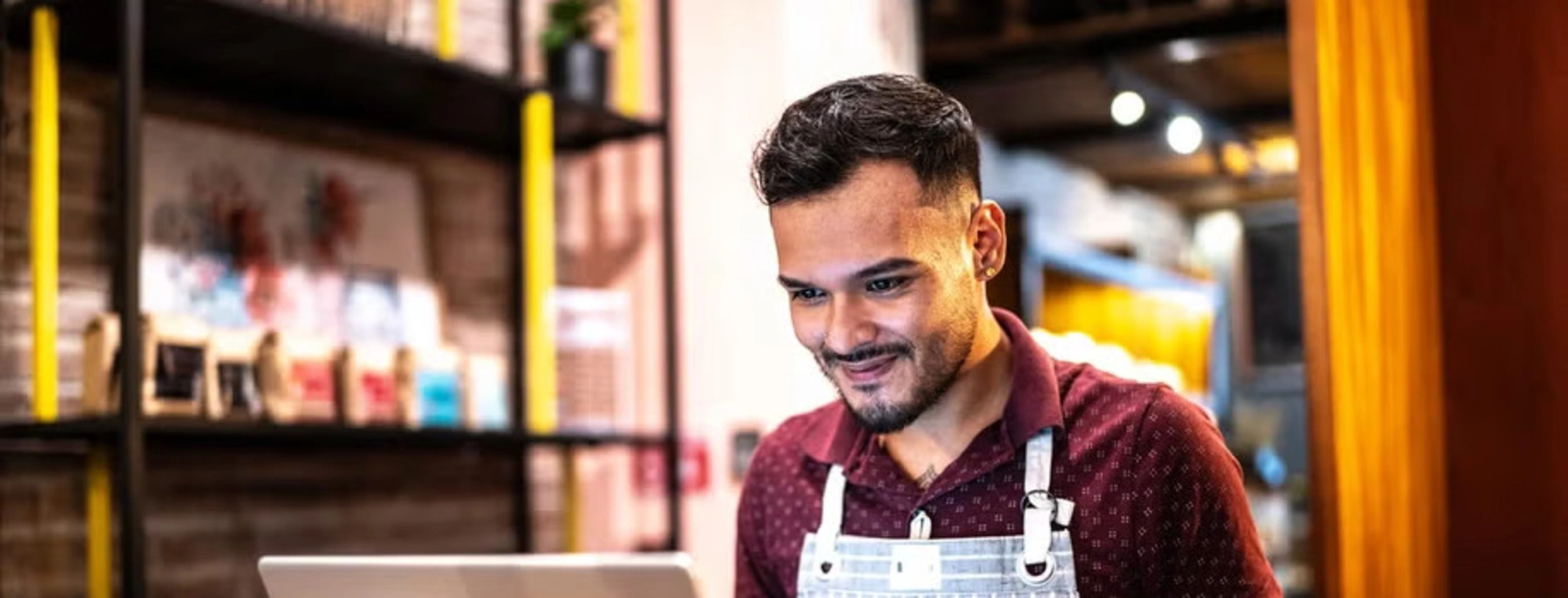 Image of an entrepreneur working at his store