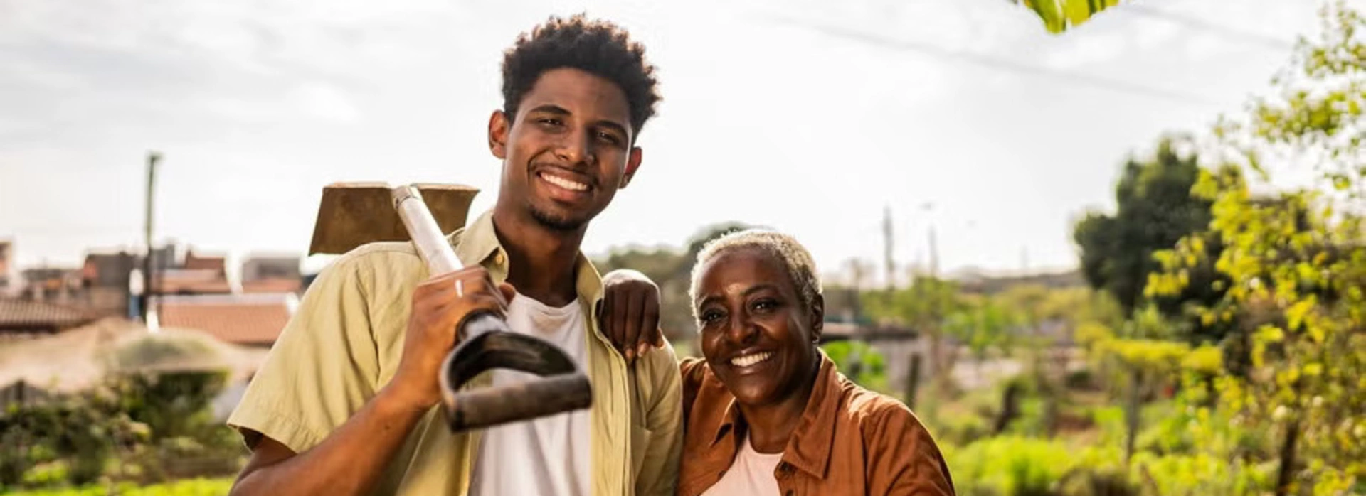 Banner image of a young african-american man and an african-american woman working on a field