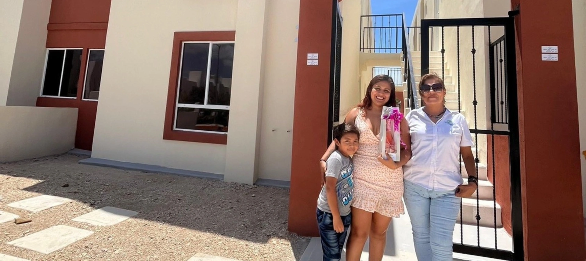 Family in front of apartment building