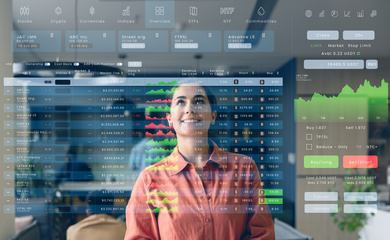 A woman looking at screens