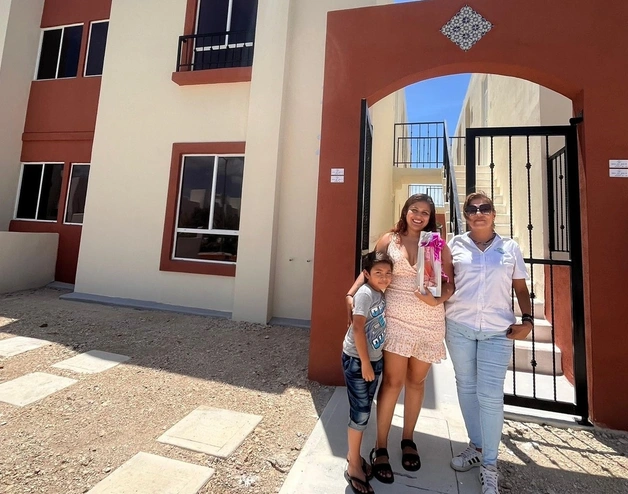 Family in front of apartment building