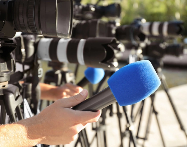 Journalist's microphones outside a press conference