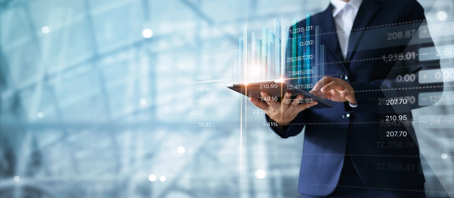 man in suit with ipad and stock market