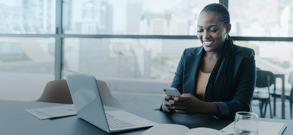 Image of a black women working at her office