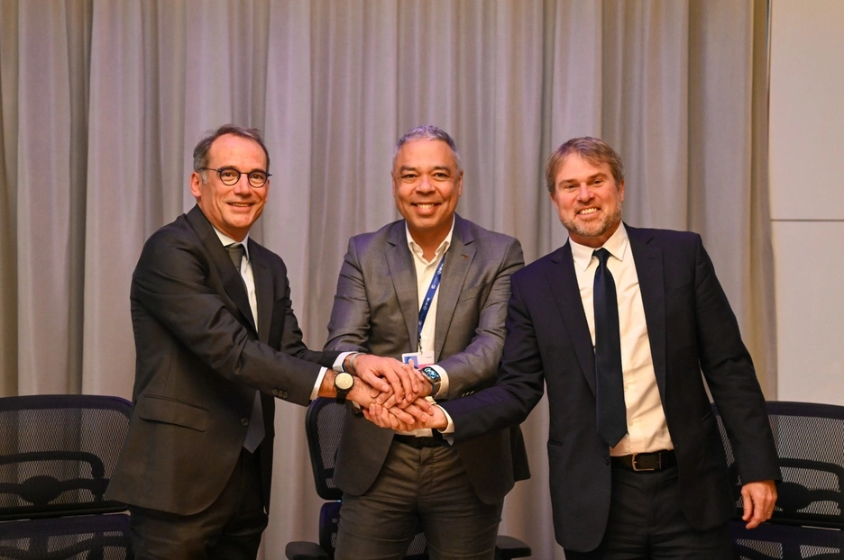 three men shaking hands