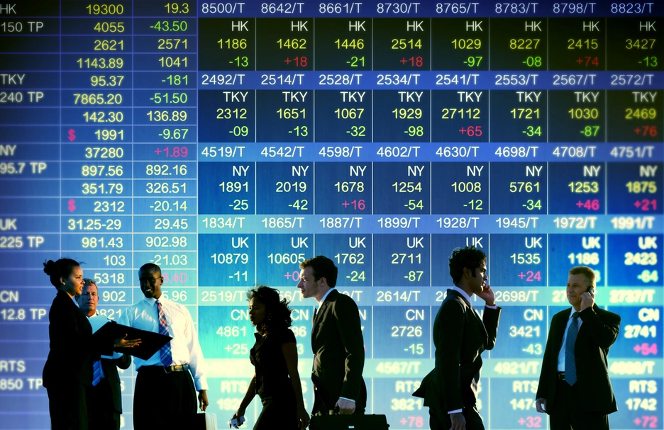 people in front of stock market screen