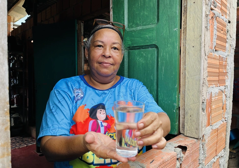 woman offering water