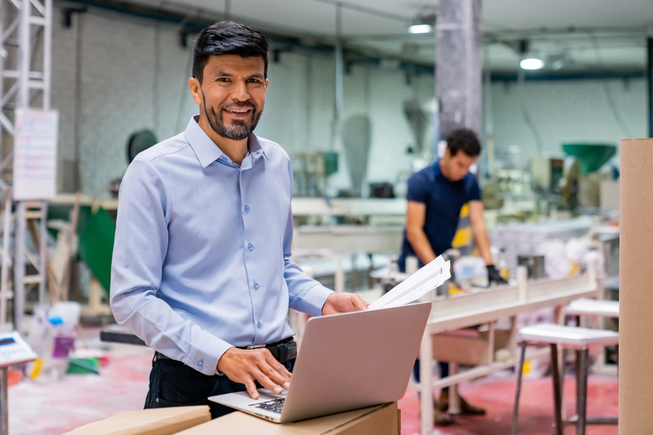 man in suit in factory