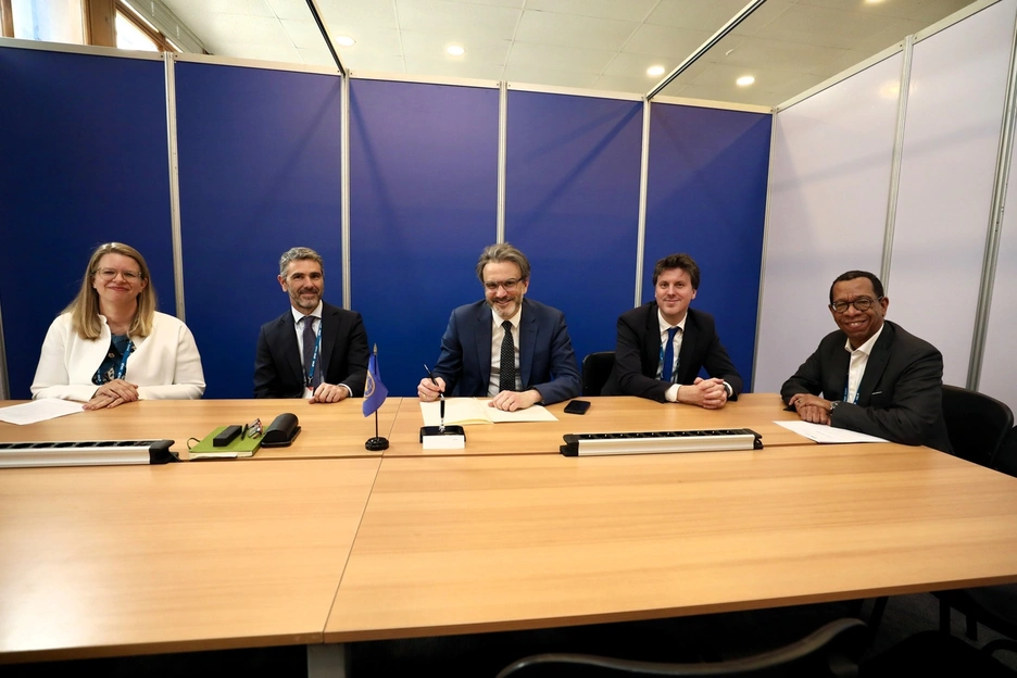 people sitting during a signing ceremony 